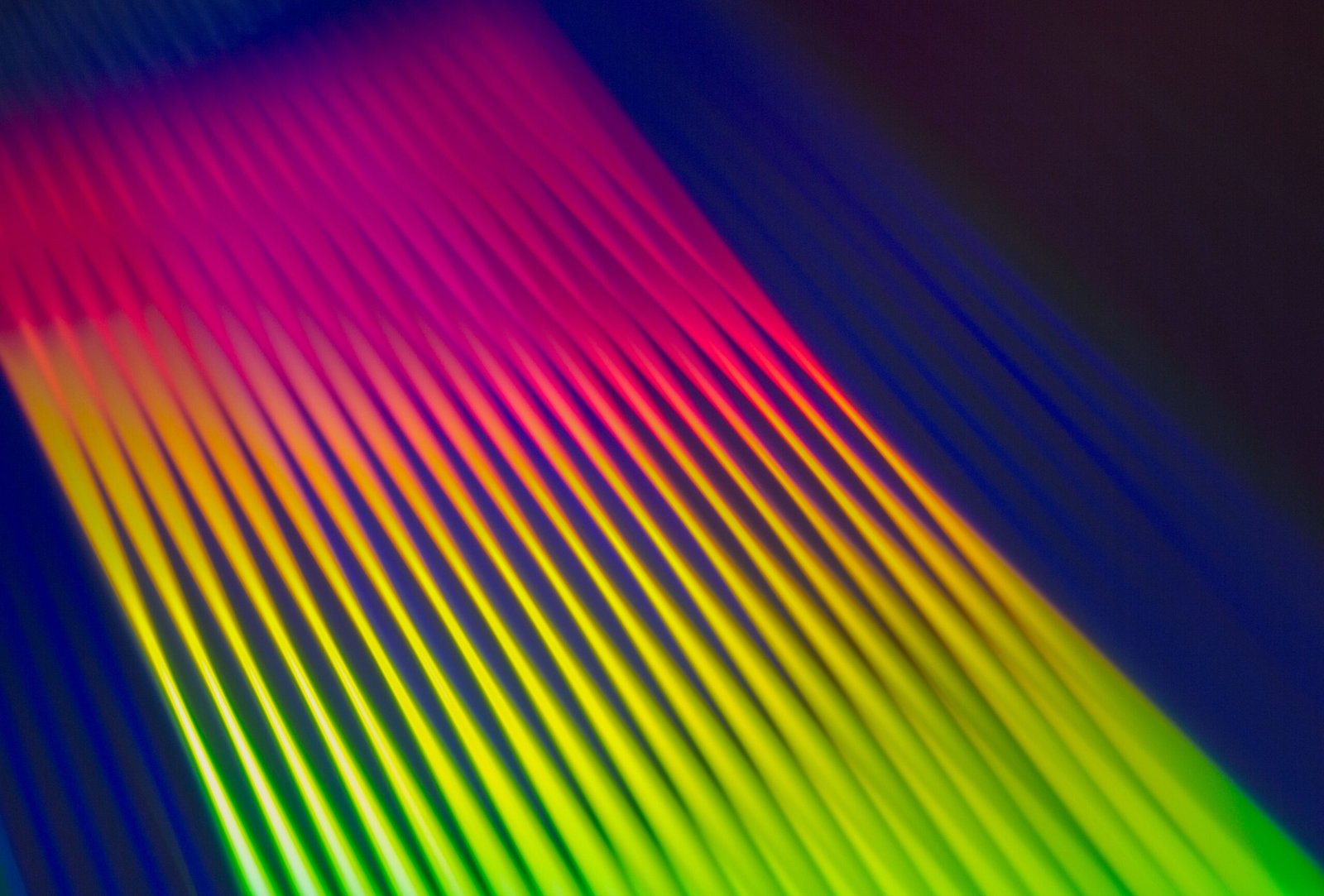 Colorful neon gradient with abstract stripes creating a vibrant, dynamic pattern.